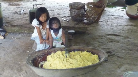 Maya and Gualcanga helping to make chicha